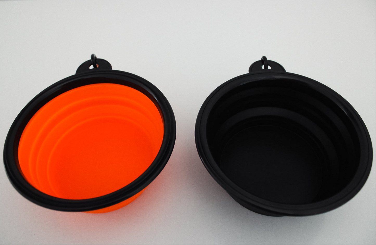 Collapsible orange and black silicone dog bowls side-by-side, 350ml capacity, The Boar Collective travel pet bowls